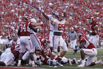 FAYETTEVILLE - SEPTEMBER 25: Alabama Crimson Tide players celebrate after Mark Ingram (not pictured) scored the game winning touchdown against the Arkansas Razorbacks at Donald W. Reynolds Razorback Stadium on September 25, 2010 in Fayetteville, Arkansas.