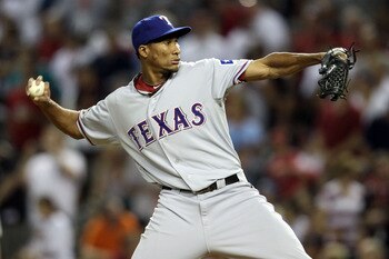 PHOENIX, AZ - JULY 12:  American League All-Star Alexi Ogando #41 of the Texas Rangers pitches in the eighth inning during the 82nd MLB All-Star Game at Chase Field on July 12, 2011 in Phoenix, Arizona.  (Photo by Christian Petersen/Getty Images)