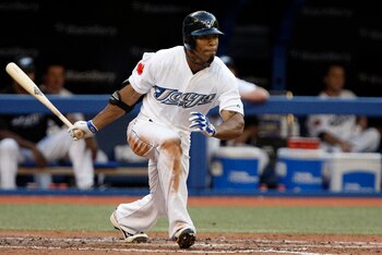 TORONTO, CANADA - JULY 15: Eric Thames #46 of the Toronto Blue Jays doubles for an RBI against the New York Yankees during MLB action at The Rogers Centre July 15, 2011 in Toronto, Ontario, Canada. (Photo by Abelimages/Getty Images)
