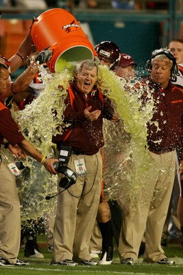 MIAMI - JANUARY 01:  Head coach Frank Beamer of the Virginia Tech Hokies gets gatorade dump on him by his players on their way to winning against the Cincinnati Bearcats during the FedEx Orange Bowl at Dolphin Stadium on January 1, 2009 in Miami, Florida.