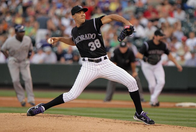 DENVER, CO - JULY 14:  Starting pitcher Ubaldo Jimenez #38 of the Colorado Rockies delviers against the Milwaukee Brewers at Coors Field on July 14, 2011 in Denver, Colorado. Jimenez earned the win as the Rockies defeated the Brewers 12-3.  (Photo by Doug