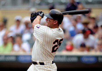 MINNEAPOLIS, MN - JULY 17: Jim Thome #25 of the Minnesota Twins hits a three-run home run against the Kansas City Royals in the sixth inning on July 17, 2011 at Target Field in Minneapolis, Minnesota. (Photo by Hannah Foslien/Getty Images)