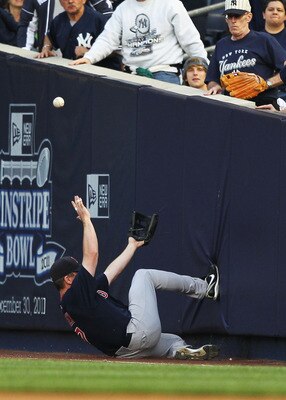 NEW YORK, NY - MAY 13:  J.D. Drew #7 of the Boston Red Sox cannot catch a foul ball hit  by Curtis Granderson #14 of the New York Yankees during their game on May 13, 2011 at Yankee Stadium in the Bronx borough of New York City.  (Photo by Al Bello/Getty
