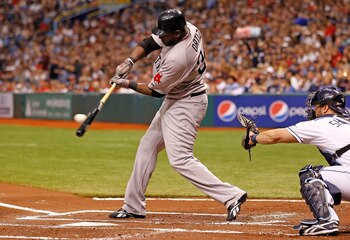 ST. PETERSBURG, FL - JULY 16:  Designated hitter David Ortiz #34 of the Boston Red Sox fouls off a pitch against the Tampa Bay Rays during the game at Tropicana Field on July 16, 2011 in St. Petersburg, Florida.  (Photo by J. Meric/Getty Images)
