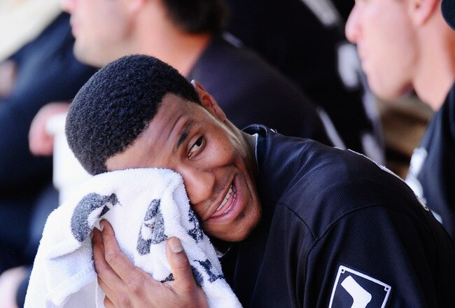 PHOENIX, AZ - MARCH 17:  Pitcher Edwin Jackson #33 of the Chicago White Sox wipes his face after giving four runs to the Milwaukee Brewers during the first inning of the spring training game at Maryvale Baseball Park on March 17, 2011 in Phoenix, Arizona.