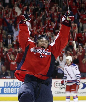 WASHINGTON, DC - APRIL 13:  Alexander Semin #28 of the Washington Capitals scores the game winning goal at 18:24 of overtime against the New York Rangers in Game One of the Eastern Conference Quarterfinals during the 2011 NHL Stanley Cup Playoffs at Veriz