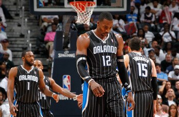 ATLANTA, GA - APRIL 24:  Dwight Howard #12 of the Orlando Magic walks downcourt after a turnover to the Atlanta Hawks during Game Four of the Eastern Conference Quarterfinals in the 2011 NBA Playoffs at Philips Arena on April 24, 2011 in Atlanta, Georgia.