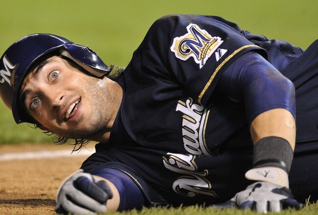 CHICAGO, IL - JUNE 15: Ryan Braun # 8 of the Milwaukee Brewers falls on the ground at third base after almost being hit by a line drive off the bat of Corey Hart during a game against the Chicago Cubs on June 15, 2011 at Wrigley Field in Chicago, Illinois