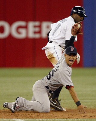 TORONTO, CANADA - MAY 10: Rajai Davis #11 of the Toronto Blue Jays steals second on Jose Iglesias #76 of the Boston Red Sox during MLB action at the Rogers Centre May 10, 2011 in Toronto, Ontario, Canada. (Photo by Abelimages/Getty Images)