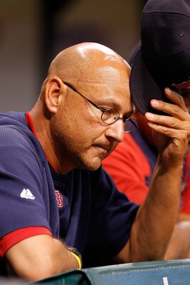 ST. PETERSBURG, FL - JULY 15:  Manager Terry Francona #47 of the Boston Red Sox scratches his head during the game against the Tampa Bay Rays at Tropicana Field on July 15, 2011 in St. Petersburg, Florida.  (Photo by J. Meric/Getty Images)