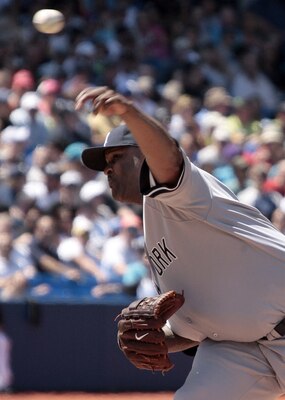 TORONTO, CANADA - JULY 16: CC Sabathia #52 of the New York Yankees throws a pitch against the Toronto Blue Jays during MLB action at The Rogers Centre July 16, 2011 in Toronto, Ontario, Canada. (Photo by Abelimages/Getty Images)