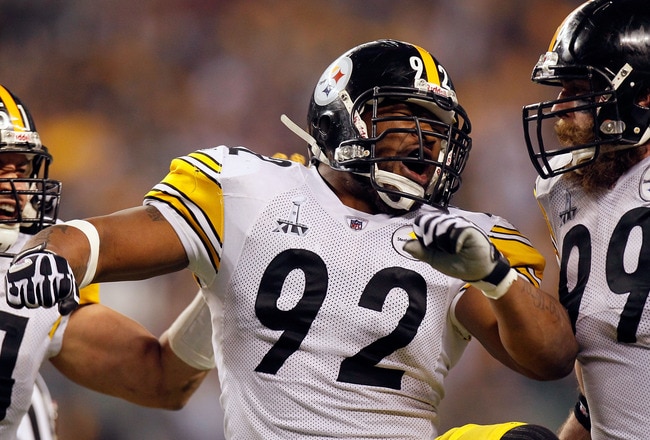 ARLINGTON, TX - FEBRUARY 06:  James Farrior #51, James Harrison #92 and Brett Keisel #99 of the Pittsburgh Steelers celebrate a defensive play against the Green Bay Packers during Super Bowl XLV at Cowboys Stadium on February 6, 2011 in Arlington, Texas.