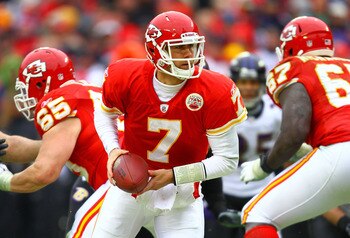 KANSAS CITY, MO - JANUARY 09:  Quarterback Matt Cassel #7 of the Kansas City Chiefs rolls out against the Baltimore Ravens in their 2011 AFC wild card playoff game at Arrowhead Stadium on January 9, 2011 in Kansas City, Missouri.  (Photo by Dilip Vishwana