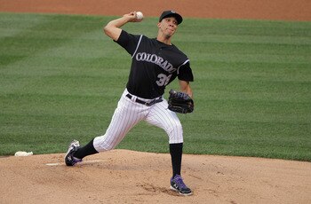 DENVER, CO - JULY 14:  Starting pitcher Ubaldo Jimenez #38 of the Colorado Rockies delviers against the Milwaukee Brewers at Coors Field on July 14, 2011 in Denver, Colorado. Jimenez earned the win as the Rockies defeated the Brewers 12-3.  (Photo by Doug