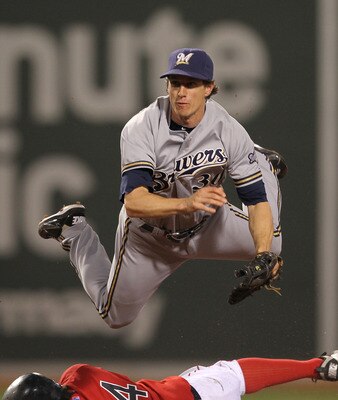 BOSTON, MA  - JUNE 17:  Craig Counsell #30 of the Milwaukee Brewers turns a double play as Darnell McDonald #54 of the Boston Red Sox slides  at Fenway Park on June 17, 2011 in Boston, Massachusetts.  (Photo by Jim Rogash/Getty Images)