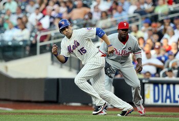 NEW YORK, NY - JULY 15:  Carlos Beltran #15 of the New York Mets breaks off first base against Ryan Howard #6 of the Philadelphia Phillies at Citi Field on July 15, 2011 in the Flushing neighborhood of the Queens borough of New York City.  (Photo by Jim M