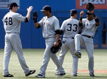 TORONTO, CANADA - JULY 17: The New York Yankees celebrate 7-2 win against the Toronto Blue Jays during MLB action at The Rogers Centre July 17, 2011 in Toronto, Ontario, Canada. (Photo by Abelimages/Getty Images)