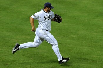 PHOENIX, AZ - JULY 12:  National League All-Star Heath Bell #21 of the San Diego Padres sprints to the mound in the eighth inning of the 82nd MLB All-Star Game at Chase Field on July 12, 2011 in Phoenix, Arizona.  (Photo by Norm Hall/Getty Images)