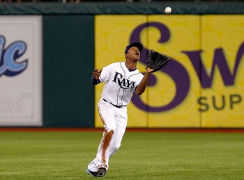 ST. PETERSBURG, FL - JULY 16:  Outfielder B.J. Upton #2 of the Tampa Bay Rays catches a fly ball against the Boston Red Sox during the game at Tropicana Field on July 16, 2011 in St. Petersburg, Florida.  (Photo by J. Meric/Getty Images)