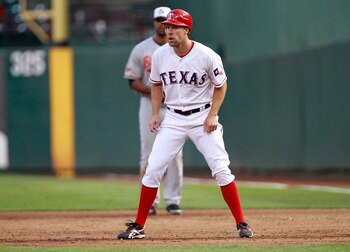 ARLINGTON, TX - JULY 4: David Murphy #7 of the Texas Rangers takes a lead of first base against the Baltimore Orioles at Rangers Ballpark in Arlington on July 4, 2011 in Arlington, Texas. (Photo by Rick Yeatts/Getty Images)