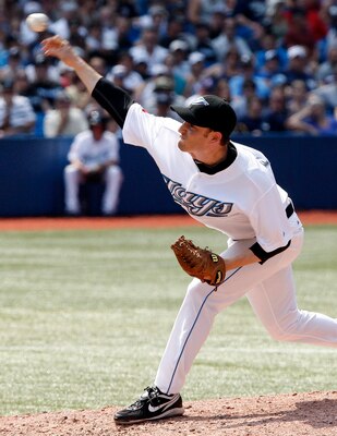 TORONTO, CANADA - JULY 17: Jason Frasor #54 of the Toronto Blue Jays throws against the New York Yankees during MLB action at The Rogers Centre July 17, 2011 in Toronto, Ontario, Canada. With this appearance he surpasse Duane Ward for all-time Blue Jays a
