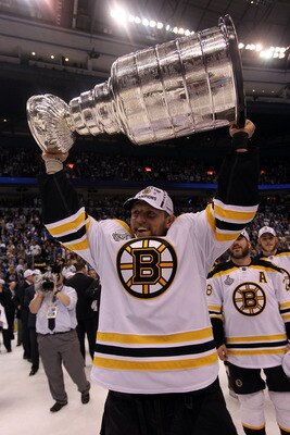 VANCOUVER, BC - JUNE 15:  Dennis Seidenberg #44 of the Boston Bruins celebrates with the Stanley Cup after defeating the Vancouver Canucks in Game Seven of the 2011 NHL Stanley Cup Final at Rogers Arena on June 15, 2011 in Vancouver, British Columbia, Can