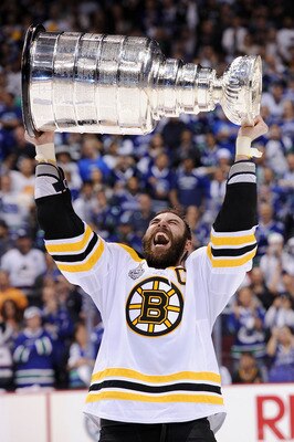 VANCOUVER, BC - JUNE 15:  Zdeno Chara #33 of the Boston Bruins celebrates with the Stanley Cup after defeating the Vancouver Canucks in Game Seven of the 2011 NHL Stanley Cup Final at Rogers Arena on June 15, 2011 in Vancouver, British Columbia, Canada. T
