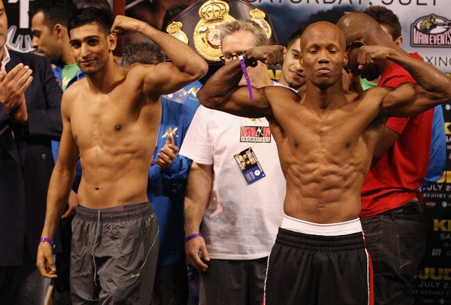 LAS VEGAS, NV - JULY 22:  Amir Khan (L) and Zab Judah during the weigh in to preview their Super Lightweight World Campionship Unification match at the Mandalay Bay Events Centre on July 22, 2011 in Las Vegas, Nevada.  (Photo by Scott Heavey/Getty Images)