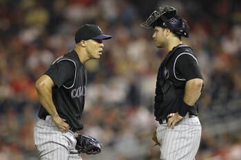 WASHINGTON, DC - JULY 09: Pitcher Ubaldo Jimenez #38 of the Colorado Rockies and catcher Chris Iannetta #20 (R) on the mound against the Washington Nationals at Nationals Park on July 9, 2011 in Washington, DC.  (Photo by Rob Carr/Getty Images)
