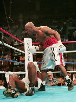 LAS VEGAS - MAY 15:  Zab Judah stands over Rafael Pineda after knocking him down in the seventh round during the WBO Intercontinental Welterweight Championship fight on May 15, 2004 at Mandalay BayEvents Center  in Las Vegas, Nevada.  (Photo by Jed Jacobs