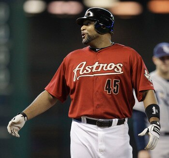 HOUSTON - JUNE 26:  Carlos Lee #45 of the Houston Astros catches his breath after hitting a triple in the first inning against the Tampa Bay Rays at Minute Maid Park on June 26, 2011 in Houston, Texas.  (Photo by Bob Levey/Getty Images)