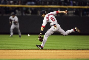 DENVER - JUNE 16:  Shortstop Nomar Garciaparra #5 of the Boston Red Sox can't get to a single by Royce Clayton of the Colorado Rockies in the first inning June 16, 2004 at Coors Field in Denver, Colorado.  (Photo by Brian Bahr/Getty Images)