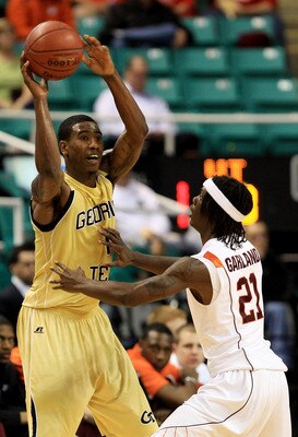 GREENSBORO, NC - MARCH 10:  Iman Shumpert #1 of the Georgia Tech Yellow Jackets looks to pass against Tyrone Garland #21 of the Virginia Tech Hokies during the first half of the game in the first round of the 2011 ACC men's basketball tournament at the Gr