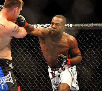 LAS VEGAS - JULY 11:  (R-L) Jon Jones connects with a right punch on Jake O'Brein during their light heavyweight bout during UFC 100 on July 11, 2009 in Las Vegas, Nevada. Jones defeated O'Brein by second round tapout.  (Photo by Jon Kopaloff/Getty Images