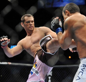 DALLAS - SEPTEMBER 19:  UFC fighter Vitor Belfort (R) battles UFC fighter Rich Franklin (L) during their Catch weight bout at UFC 103: Franklin vs. Belfort at the American Airlines Center on September 19, 2009 in Dallas, Texas.  (Photo by Jon Kopaloff/Get