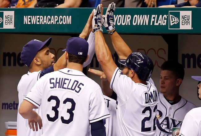 ST. PETERSBURG, FL - JULY 18:  Designated hitter Johnny Damon #22 of the Tampa Bay Rays is congratulated by pitchers James Shields #33 and David Price #14 after scoring a run against the New York Yankees during the game at Tropicana Field on July 18, 2011