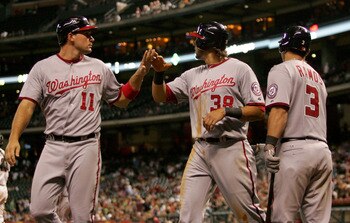 HOUSTON,TX- JULY 18:  Ryan Zimmerman #11 high fives Michael Morse #38 of the Washington Nationals after they scored in the 9th inning against the  Houston Astros on July 18, 2011 at Minute Maid Park in Houston, Texas.The Nationals won 5 to 2. (Photo by Th