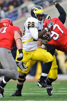 COLUMBUS, OH - NOVEMBER 27:  Fitzgerald Toussaint #28 of the Michigan Wolverines runs with the ball against the Ohio State Buckeyes at Ohio Stadium on November 27, 2010 in Columbus, Ohio.  (Photo by Jamie Sabau/Getty Images)