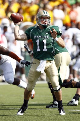 WACO, TX - NOVEMBER 14:  Quarterback Nick Florence #11 of the Baylor Bears drops back to pass during the first half against the Texas Longhorns on November 14, 2009 at Floyd Casey Stadium in Waco, Texas.  The Longhorns beat the Bears 47-14.  (Photo by Tom