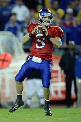 KANSAS CITY, MO - NOVEMBER 28: Quarterback Todd Reesing #5 of the Kansas Jayhawks looks to make a pass play during the game against the Missouri Tigers at Arrowhead Stadium on November 28, 2009 in Kansas City, Missouri. (Photo by Jamie Squire/Getty Images