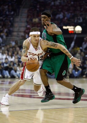 CLEVELAND - MAY 16:  Delonte West #13 of the Cleveland Cavaliers drives against Rajon Rondo #9 of the Boston Celtics in Game Six of the Eastern Conference Semifinals during the 2008 NBA Playoffs on May 16, 2008 at the Quicken Loans Arena in Cleveland, Ohi