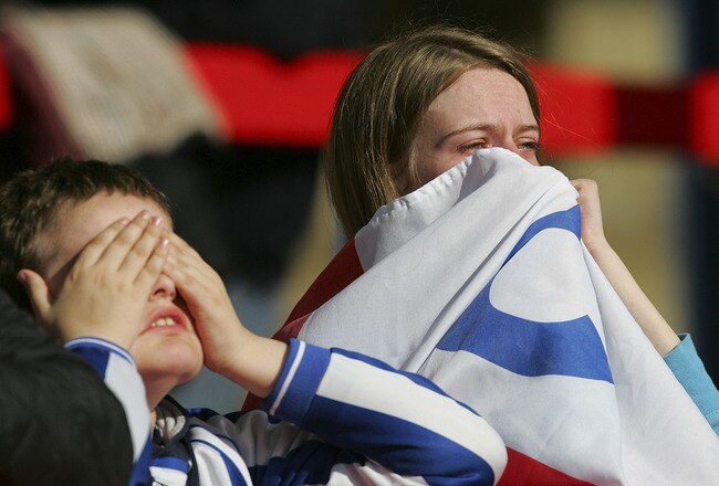 ALDERSHOT, UNITED KINGDOM - APRIL 25: Chester City fans show their disapointment as their club has been relegated after the Coca-Cola League Two match between Aldershot Town and Chester City at the Recreation Ground on April 25, 2009 in Aldershot, England