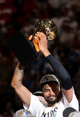 MIAMI, FL - JUNE 12:  Tyson Chandler #6 of the Dallas Mavericks celebrates with the Larry O'Brien Championship trophy after the Mavericks won 105-95 against the Miami Heat in Game Six of the 2011 NBA Finals at American Airlines Arena on June 12, 2011 in M