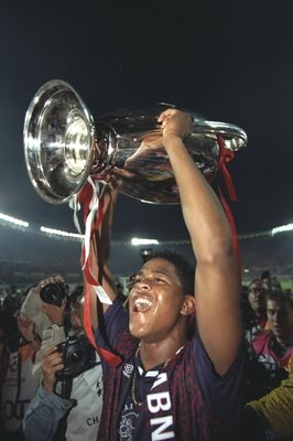 24 May 1995:  Patrick Kluivert of Ajax raises the trophy in celebration after their victory in the European Cup Final against AC Milan in Vienna, Austria. Ajax won the match 1-0. \ Mandatory Credit: Clive  Brunskill/Allsport