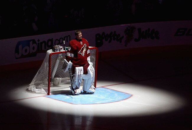 GLENDALE, AZ - APRIL 20:  Goaltender Ilya Bryzgalov #30 of the Phoenix Coyotes stands attended for the National Anthem before Game Four of the Western Conference Quarterfinals against the Detroit Red Wings during the 2011 NHL Stanley Cup Playoffs at Jobin
