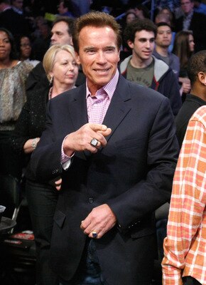 LOS ANGELES, CA - FEBRUARY 20:  Former governor of California Arnold Schwarzenegger poses courtside during the 2011 NBA All-Star game at Staples Center on February 20, 2011 in Los Angeles, California. NOTE TO USER: User expressly acknowledges and agrees t