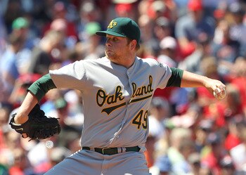 BOSTON, MA - JUNE 5: Brett Anderson #49 of the Oakland Athletics throws against the Boston Red Sox at Fenway Park on June 5, 2011 in Boston, Massachusetts.  (Photo by Jim Rogash/Getty Images)