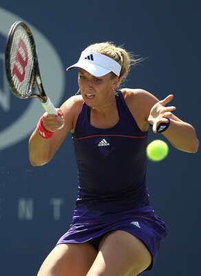 NEW YORK - SEPTEMBER 02:  Sabine Liscki of Germany hits a return against Vera Zvonareva of Russia during her women's singles match on day four of the 2010 U.S. Open at the USTA Billie Jean King National Tennis Center on September 2, 2010 in the Flushing n