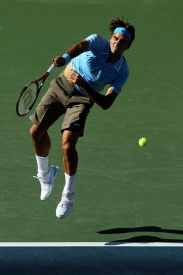 NEW YORK - SEPTEMBER 11:  Roger Federer of Switzerland serves against Novak Djokovic of Serbia during his men's singles semifinal match on day thirteen of the 2010 U.S. Open at the USTA Billie Jean King National Tennis Center on September 11, 2010 in the