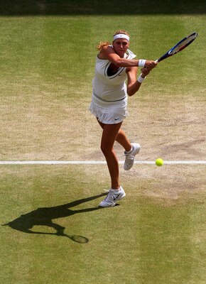 LONDON, ENGLAND - JULY 02:  Petra Kvitova of the Czech Republic returns a shot during her Ladies' final round match against Maria Sharapova of Russia on Day Twelve of the Wimbledon Lawn Tennis Championships at the All England Lawn Tennis and Croquet Club